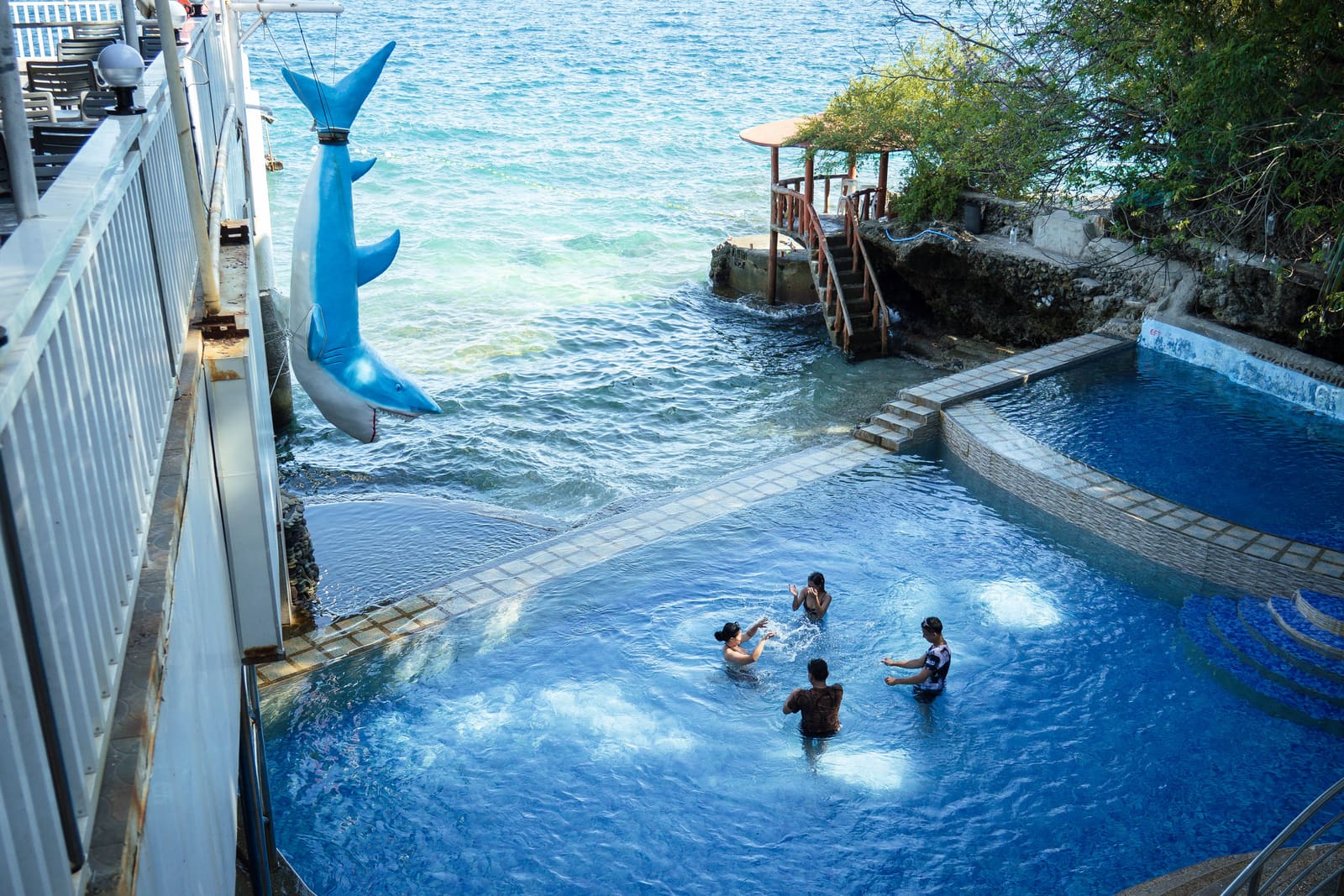Seaside pool with the shark sculpture and gazebo at Isola Vista Beach Resort, Batangas City